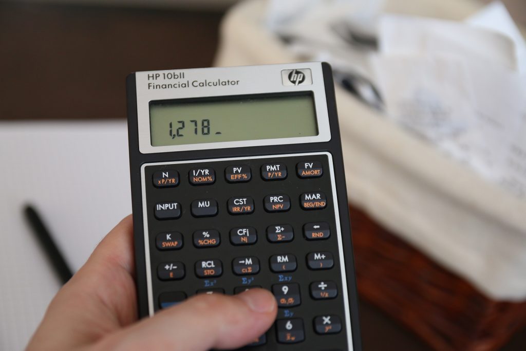 Image of person using calculator 