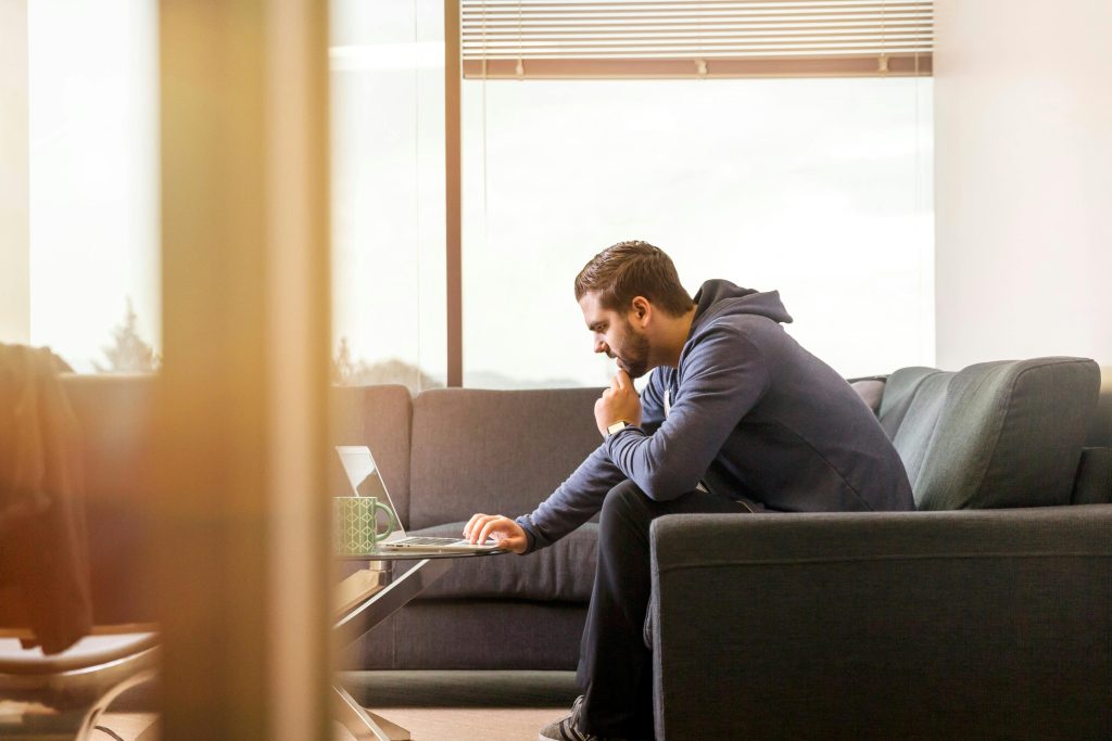 Image of man looking at laptop