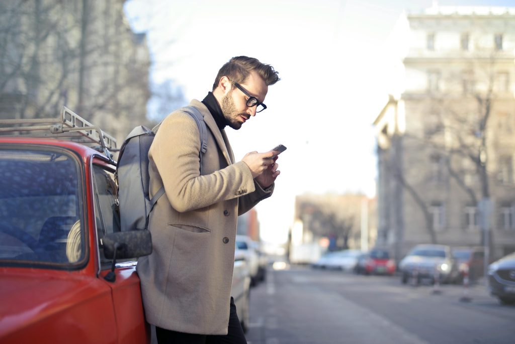 Image of male holding mobile